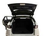 the back of a white car with its trunk open on a white background