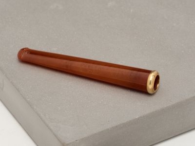 a pen that is laying on top of a piece of paper