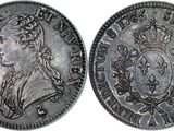 a silver coin with an image of a man on it