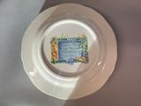 a plate with a picture on it sitting on a table