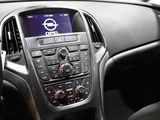the interior of a car with a steering wheel and dashboard controls