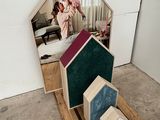a picture of a house made out of wood and a mirror