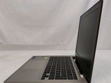 a laptop that is sitting on a white surface