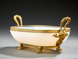 a white bowl with a gold decoration on it