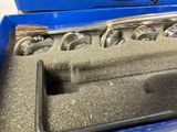 a blue case that has a bunch of golf clubs in it