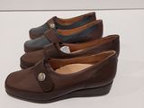 three pairs of women ' s shoes are lined up on a white surface