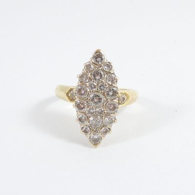 a close up of a diamond ring on a white surface