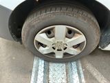 a close up of a tire on the side of a car