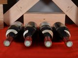 several bottles of wine are lined up in a row on a table