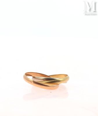 an image of a close up of a gold ring on a white surface