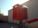 a red box sitting on top of a metal pole