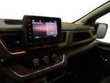 the interior of a car with a large screen in the center