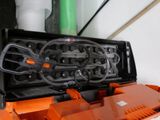 a black and orange box with a pair of scissors inside of it