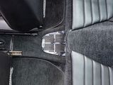 a close up of a car ' s floor with a pedal cover