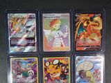 a lot of different pokemon cards in the box