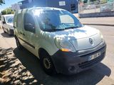 a small white van parked on the side of the road