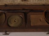 a wooden box with a clock inside of it