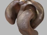 a close up of a metal object on a gray background