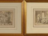 two framed drawings of a man and a woman in a room
