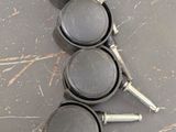 four cast iron pans are lined up on a table