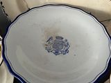 many plates and cups sitting on a table
