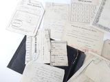 a lot of old papers that are on a table