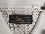 the label on the shirt says, ` ` person ' and is attached to the collar of the shirt