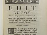 an open book with a picture of a bird and flowers on it