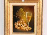 tableau représentant un verre de vin et des raisins posés sur une table