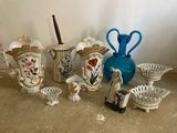 many different vases and bowls sitting on the floor