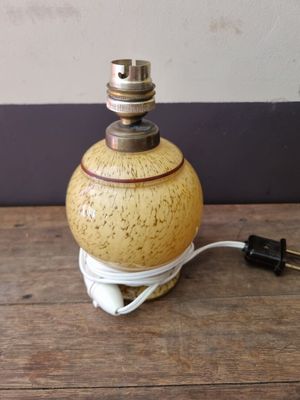 a small lamp that is on a wooden table