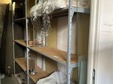 a room that has a shelf with a lot of items on it