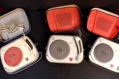 several different types of portable speakers are lined up on a black surface