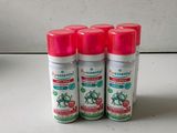 three spray bottles of insect repellent on a table