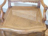 a wooden chair with a woven seat and back