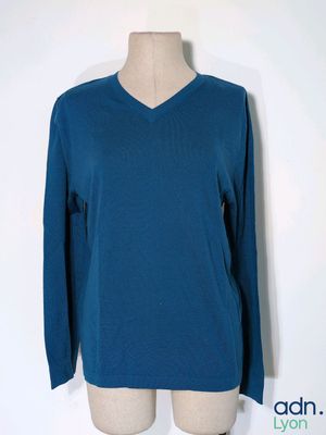 blue v - neck sweater on a mannequin mannequin mannequin mannequin mannequin mannequin mannequin mannequin mann