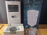 a box with a white air conditioner sitting on a table