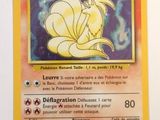 the pokemon card has a picture of a yellow flower on it