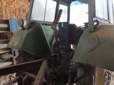 a tractor that is parked inside of a building