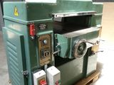 a machine that is sitting on a pallet in a warehouse