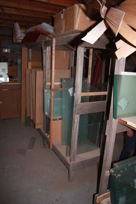 many boxes stacked on top of each other in a room