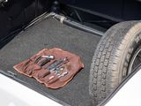 the trunk of a car with tools in the trunk of it