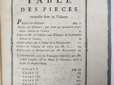 an old book with a black and white image of a table on it