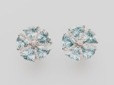 a pair of aquamarinee and diamond earrings