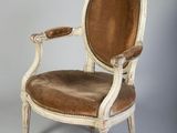 an image of a chair with a brown leather seat on a white background