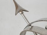 a metal sculpture with a star on top of it