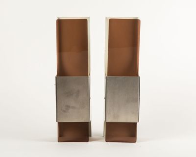 pair of silver and copper bookends on a white background