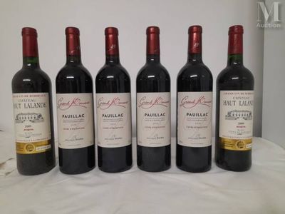four bottles of wine are lined up on a table