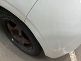 a white car that is parked in a parking lot