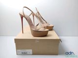 christiane heels in box on white surface with white background